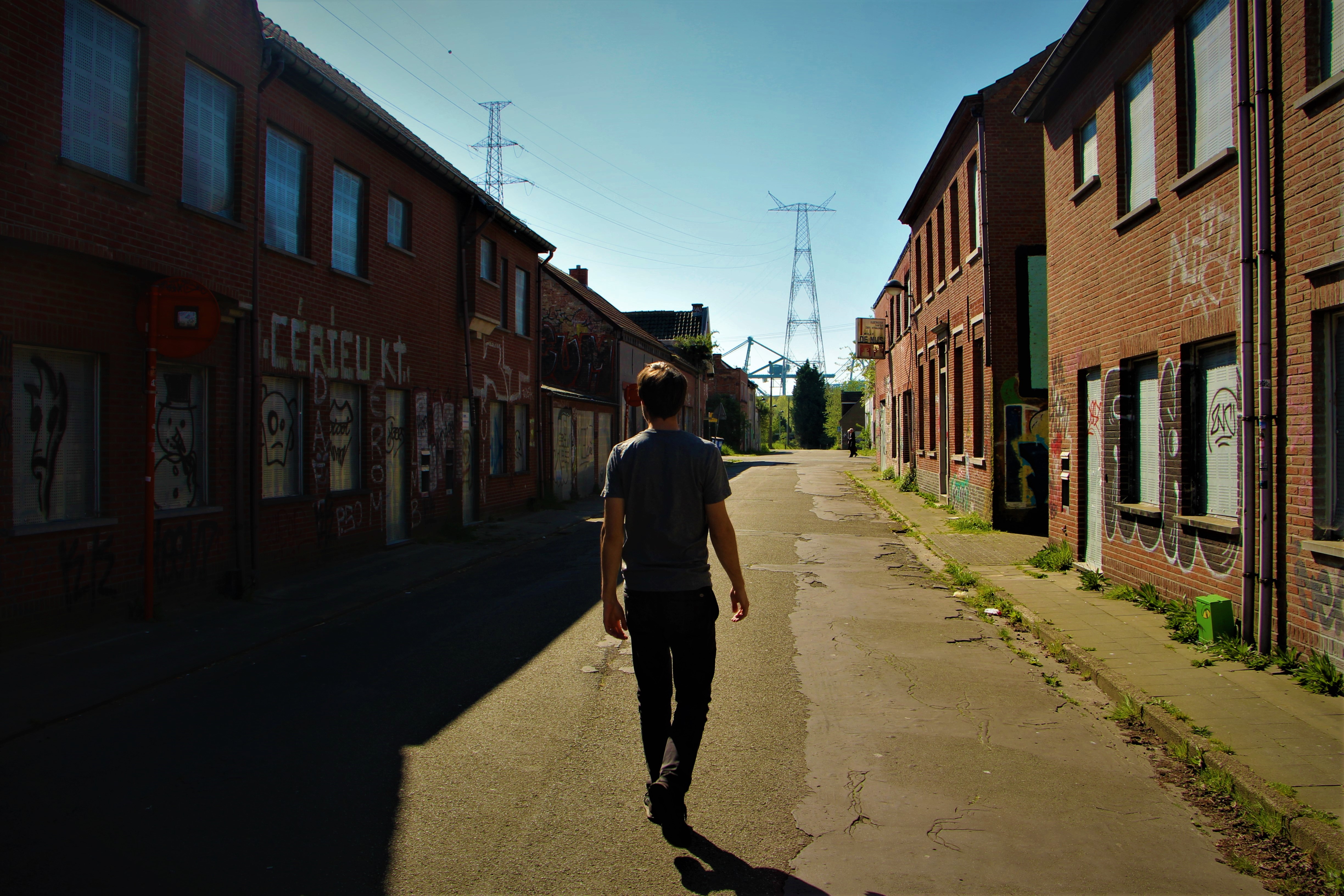 Walking down the the main street of ghost town of Doel, Belgium